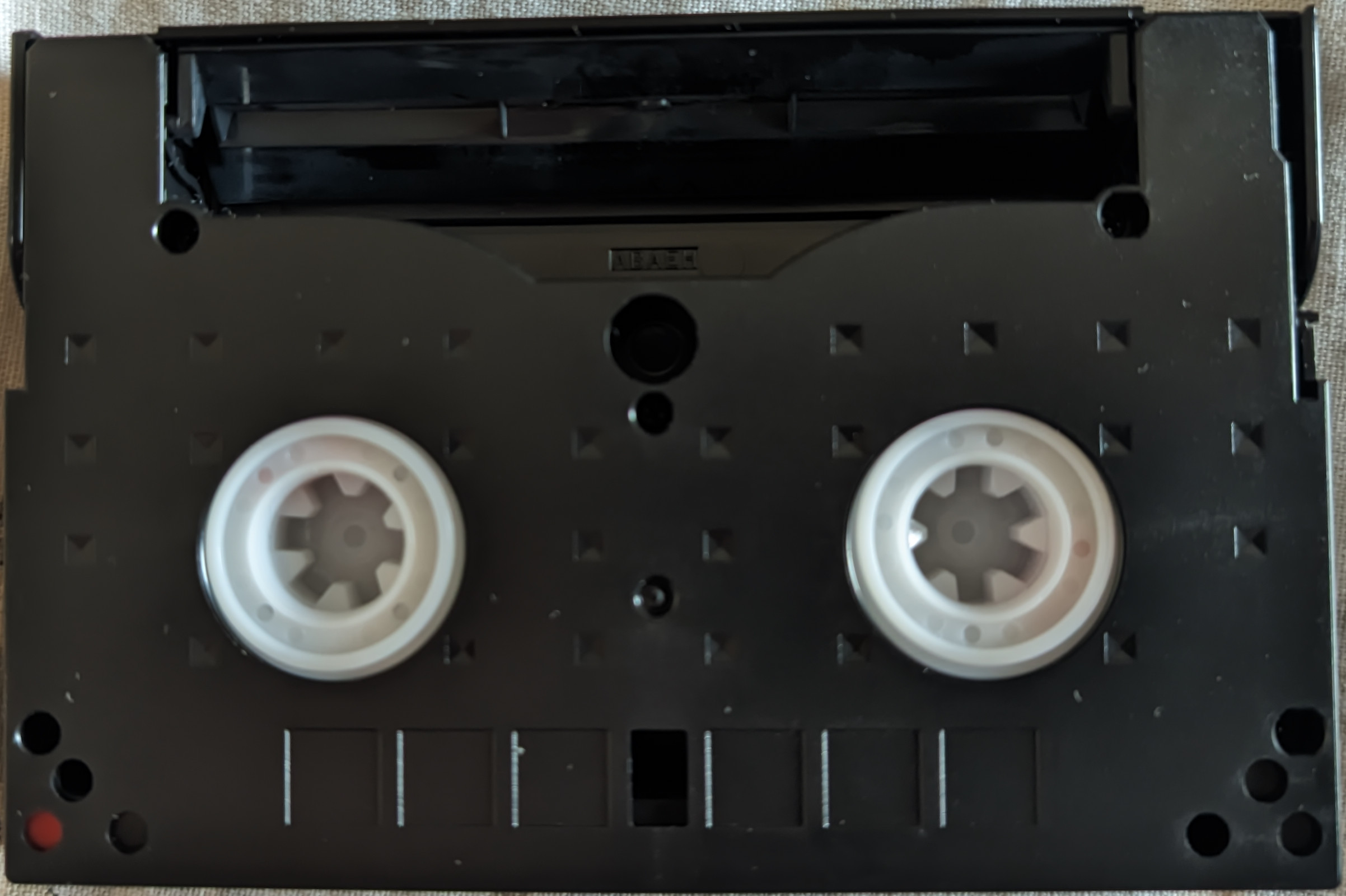 image with a video8 cassette with one of its holes punched